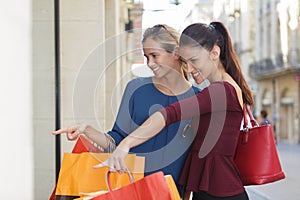 Young happy and wealthy women shopping photo