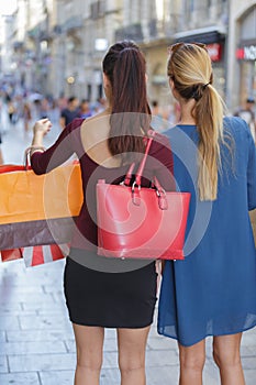 Young happy and wealthy women shopping