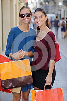 Young happy and wealthy women shopping photo