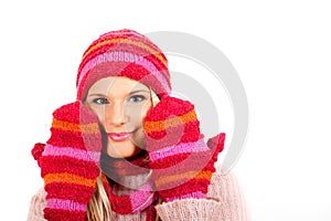 Young happy winter woman in pink gloves