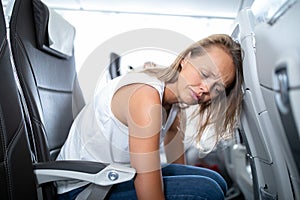 Young  woman  during flight  - not feeling quite well photo