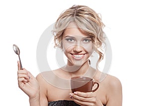 Young happy woman with an aromatic coffee in hands. Isolated