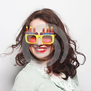 Young happy woman with big orange sunglasses