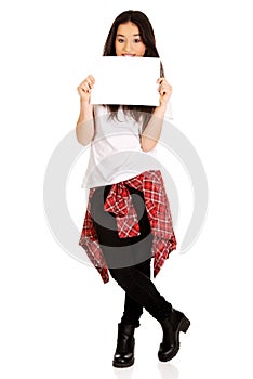 Young happy woman with blank board.