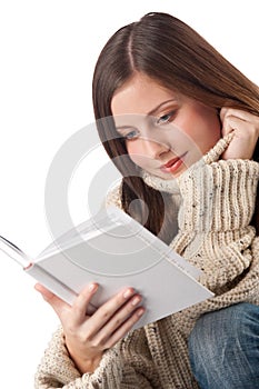 Young happy woman with book wearing turtleneck