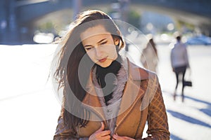 Young happy woman in brown leather jacket