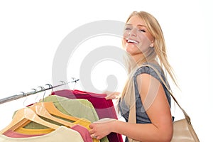 Young happy woman in clothes store