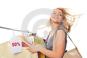 Young happy woman in clothes store