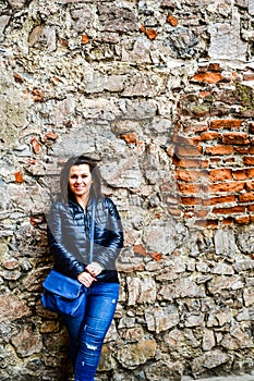 Young happy woman at Corvin Castle, Romania