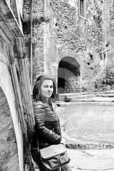 Young happy woman at Corvin Castle, Romania