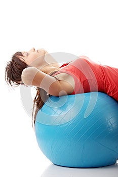 Young happy woman doing fitness exercise