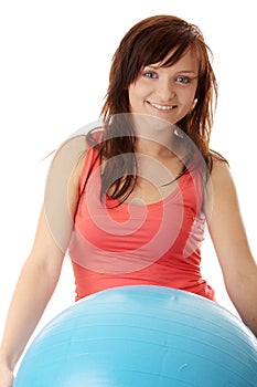 Young happy woman doing fitness exercise