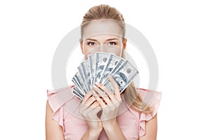 Young happy woman with dollars in hand. Isolated.