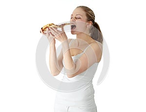 Young happy woman eating pizza