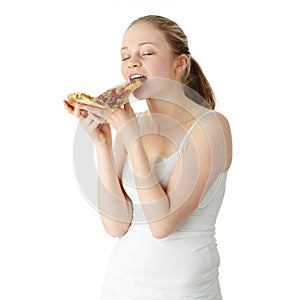 Young happy woman eating pizza