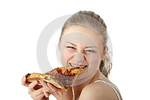 Young happy woman eating pizza