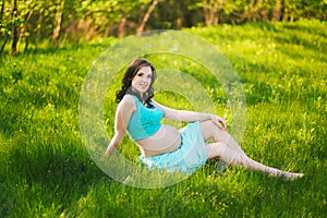 Young happy woman in expectation of baby