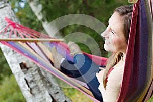 Young happy woman in hammock