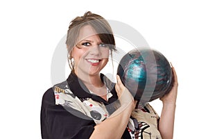 Young happy woman holding bowling ball