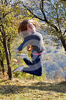 Young happy woman outdoor in autumn