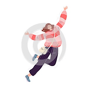 Young happy woman in a pink sweater and black pants fun jumps and laughs