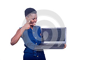 Young happy woman pointing finger on laptop