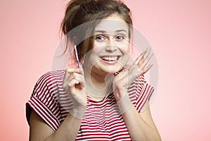 Young happy woman with positive result result of a one-time pregnancy test, excited future mother, family planning, motherhood