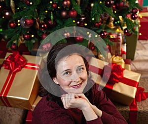 Young happy woman received new year gifts