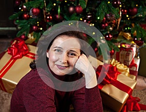 Young happy woman received new year gifts