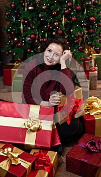 Young happy woman received new year gifts