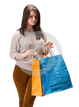 Young happy woman with shopping bags and dollar cash money