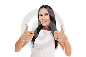 Young happy woman showing thumbs up