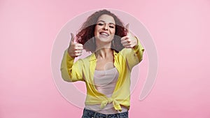 young happy woman showing thumbs up