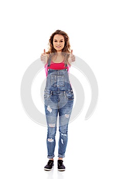 Young happy woman showing thumbs up