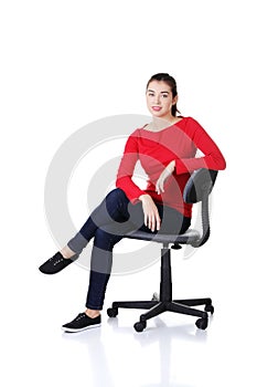 Young happy woman sitting on a wheel chair