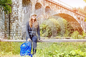 Young happy woman traveling with backpack