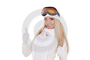 Young woman in winter warm clothes and ski glasses