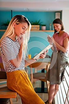 Young woman working with tablet in office. People digital device business education concept