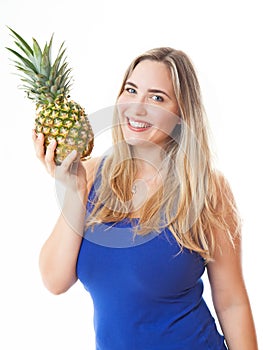 Young healthy beautiful woman with a pineapple