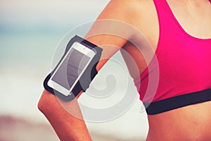 Young Healthy Fitness Woman with Smart Phone