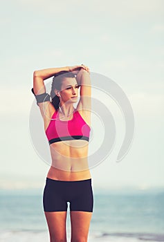 Young Healthy Fitness Woman with Smart Phone