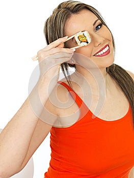 Young Healthy Happy Woman Holding Japanese Style Sushi with Chop Sticks