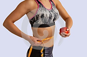 Young healthy slim woman in sportswear