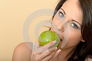 Young Healthy Woman Eating A Green Shiny Healthy Apply