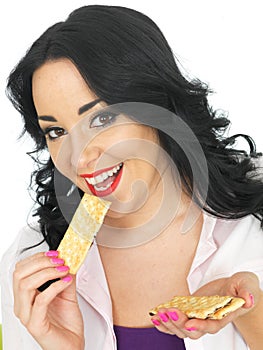 Young Healthy Woman Eating Thin Crispy Crackers