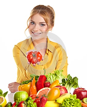 Young healthy woman with fruits and vegetables.