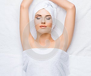 Young and healthy woman gets massage treatments for face, skin and neck in the spa salon. Health, wellness and