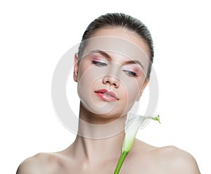 Young healthy woman portrait. Female face with white flower isolated on white background