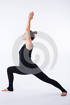 Young healthy woman practicing Balancing stick posture yoga on white background.