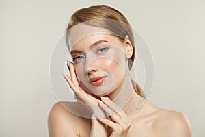 Young healthy woman spa model with clear skin. Skincare, wellness and facial treatment concept
